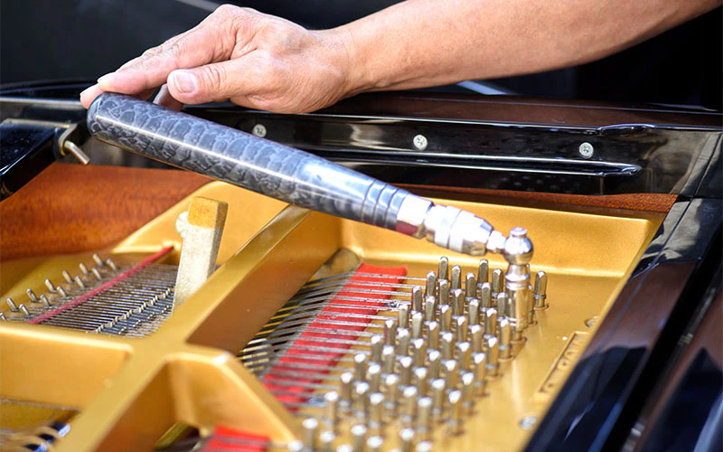 Identify the current pitch of the string by using a tuning fork or a digital tuner as a reference.
Turn the tuning pins using a tuning lever to adjust the tension of the strings until the desired pitch is achieved.
Continuously check the pitch accuracy of each note by comparing it to a reference pitch and making necessary adjustments.